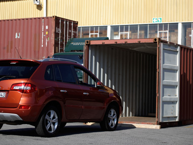 car and container for a vehicle transfer