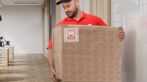 Mover lifting a box in an office